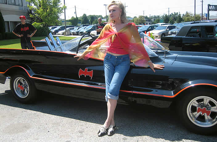 Julie Newmar stands by the “Rock Star” Batmobile at the 2008 Super Mega Show in Secaucus, NJ.